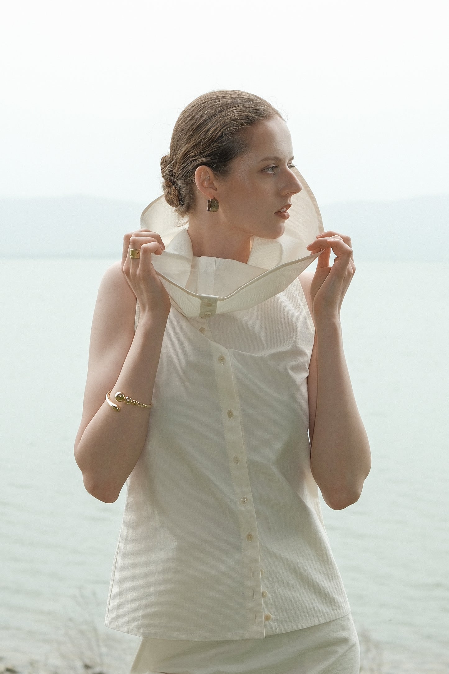 Ully Cream Diagonal Button Sleeveless top