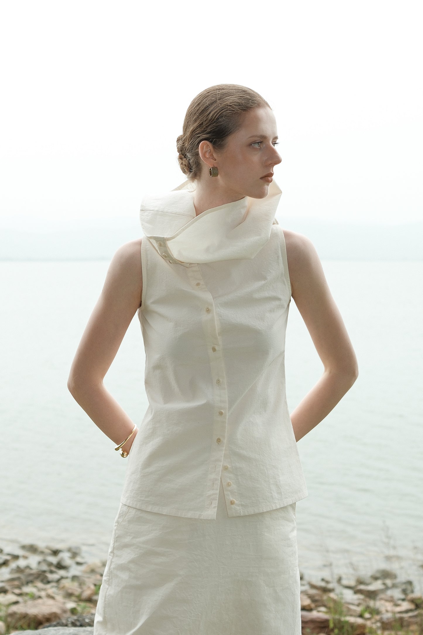 Ully Cream Diagonal Button Sleeveless top