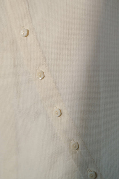 Ully Cream Diagonal Button Sleeveless top