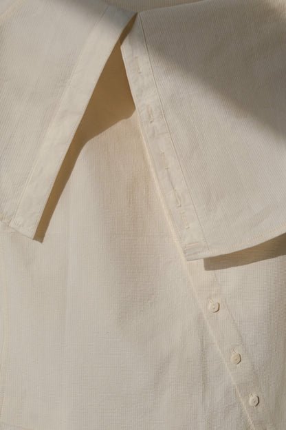 Ully Cream Diagonal Button Sleeveless top